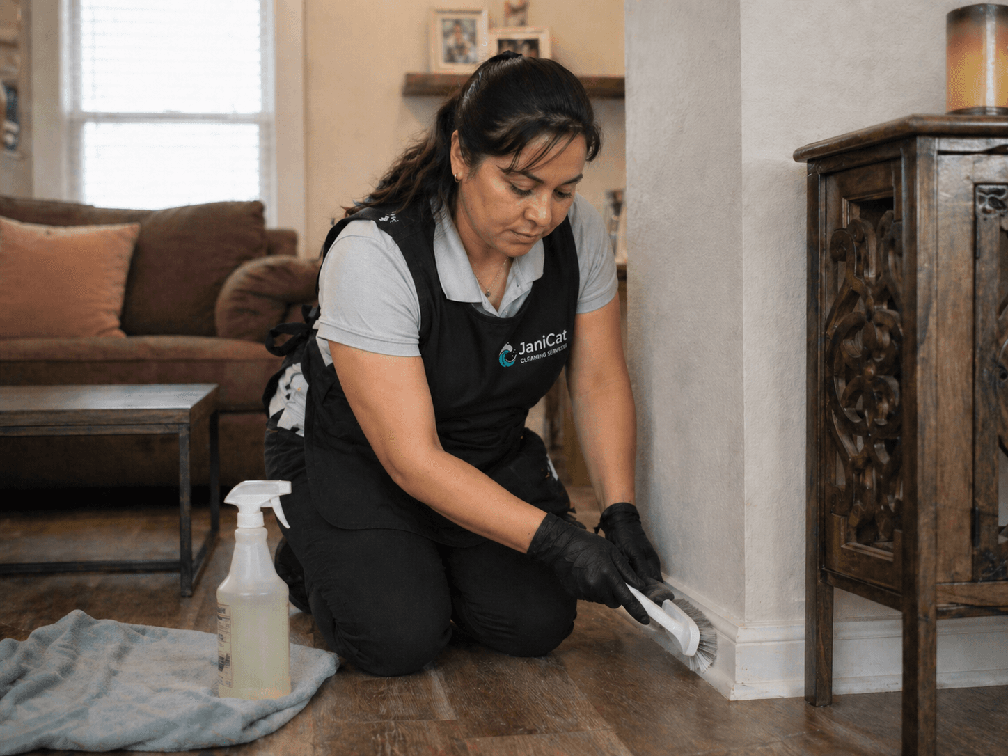 Janicat team member deep-cleaning a baseboard in a Seattle home